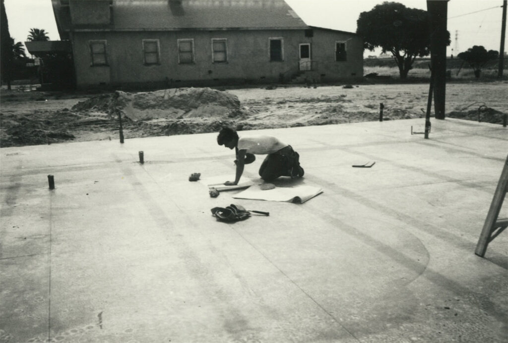 In 1978, a staff member lays the foundation of Omni Family Health’s fist health center in Buttonwillow, California.